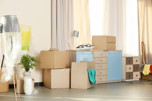 Moving team loading household items into a vehicle