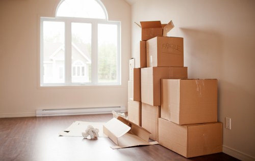 Loading furniture and boxes into a van in Maida Vale