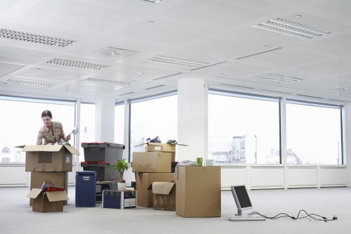 Maida Vale movers organizing packed household items for transport